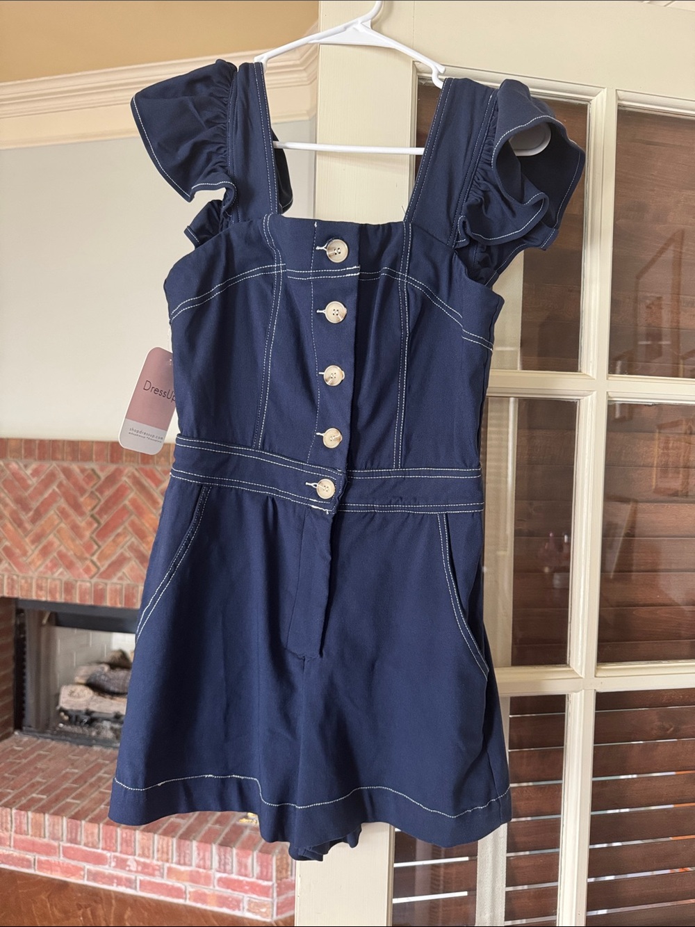 Navy Button-Front Ruffle Sleeve Romper